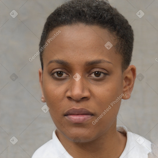 Joyful black young-adult female with short  brown hair and brown eyes