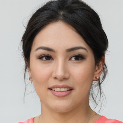 Joyful asian young-adult female with medium  brown hair and brown eyes