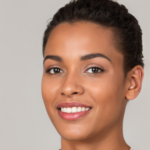 Joyful white young-adult female with short  brown hair and brown eyes