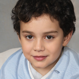 Joyful white child male with short  brown hair and brown eyes