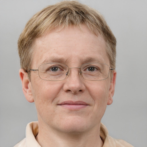 Joyful white middle-aged male with short  brown hair and grey eyes