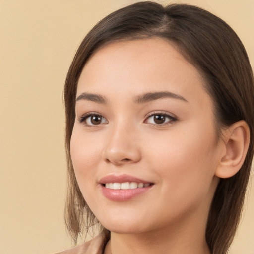 Joyful white young-adult female with long  brown hair and brown eyes