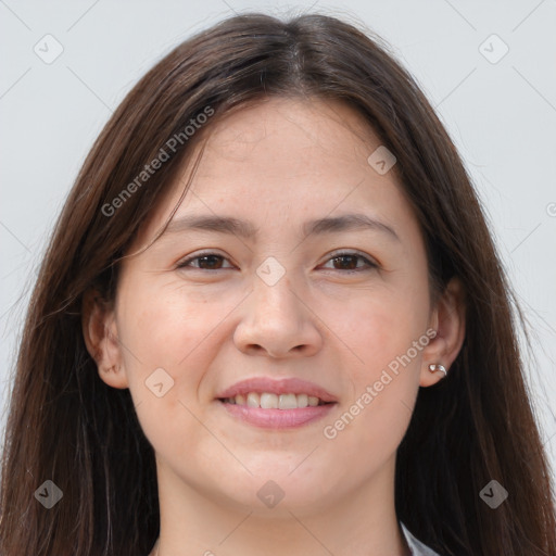 Joyful white young-adult female with long  brown hair and brown eyes