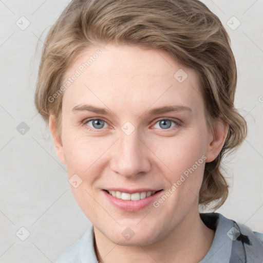 Joyful white young-adult female with medium  brown hair and blue eyes