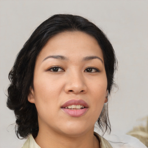 Joyful asian young-adult female with medium  black hair and brown eyes