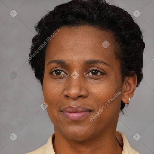 Joyful black adult female with short  brown hair and brown eyes