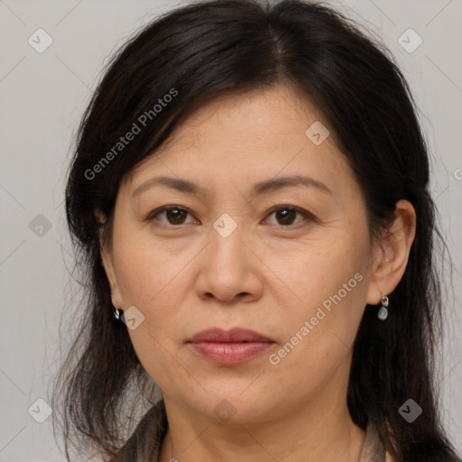 Joyful white adult female with medium  brown hair and brown eyes