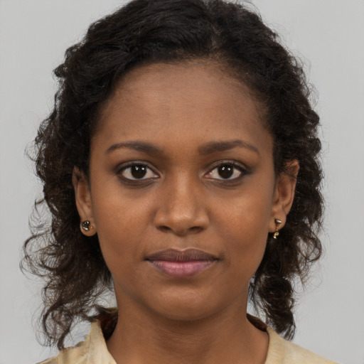 Neutral black young-adult female with long  brown hair and brown eyes