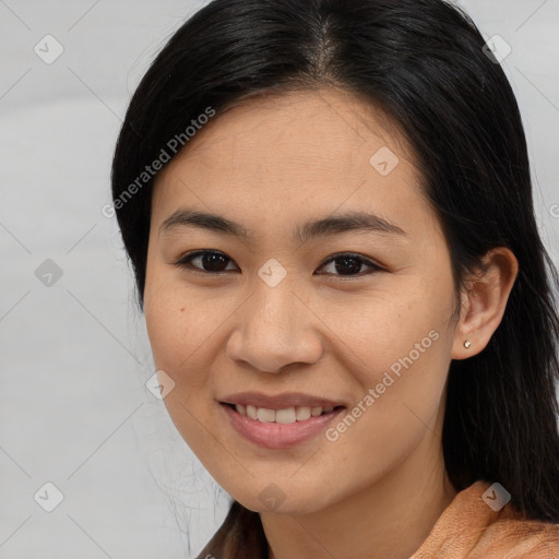 Joyful asian young-adult female with medium  brown hair and brown eyes