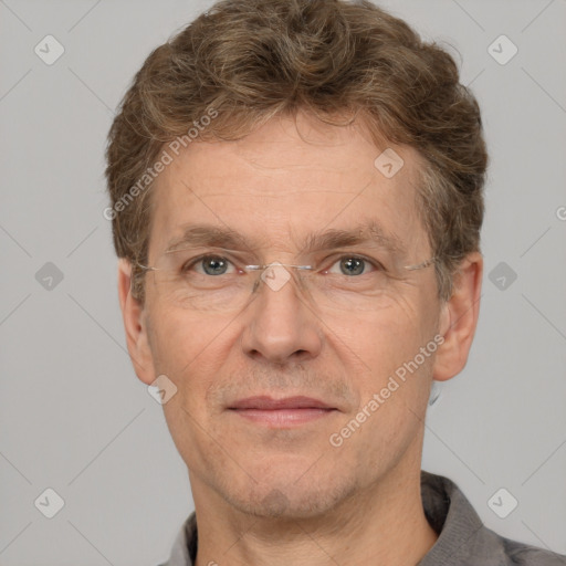 Joyful white adult male with short  brown hair and grey eyes