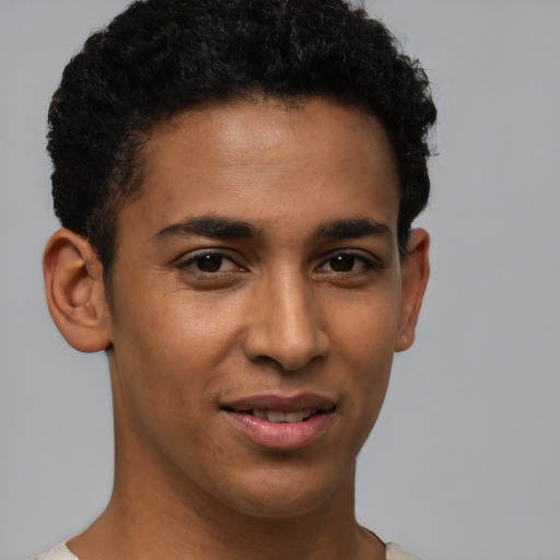 Joyful latino young-adult male with short  brown hair and brown eyes