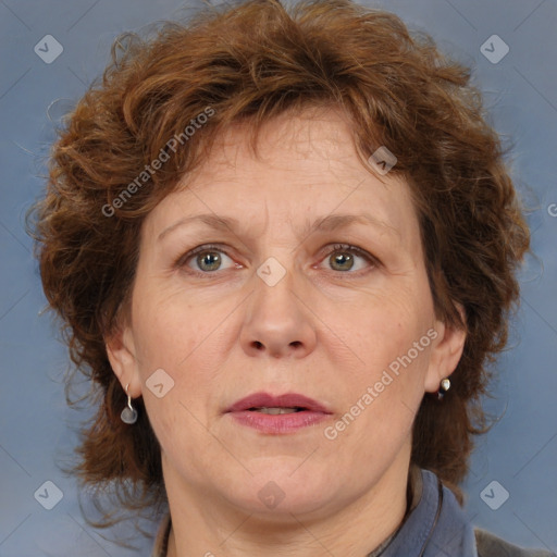 Joyful white adult female with medium  brown hair and blue eyes