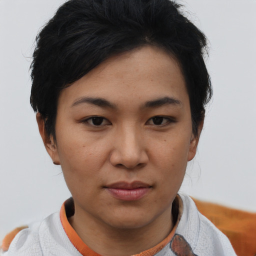 Joyful asian young-adult female with short  brown hair and brown eyes