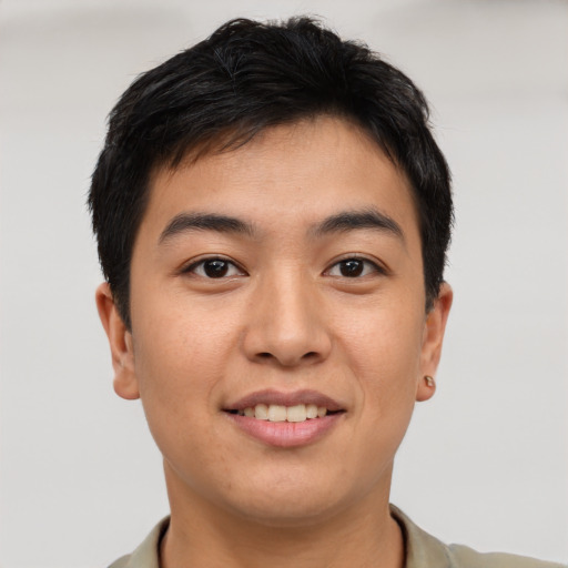 Joyful asian young-adult male with short  brown hair and brown eyes