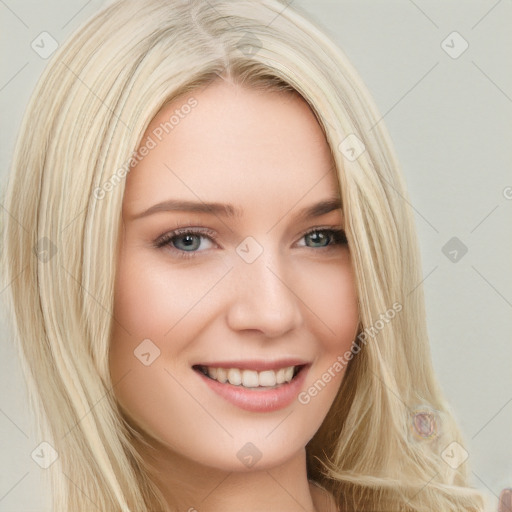 Joyful white young-adult female with long  blond hair and brown eyes