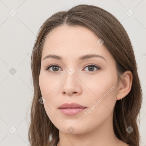 Neutral white young-adult female with long  brown hair and brown eyes