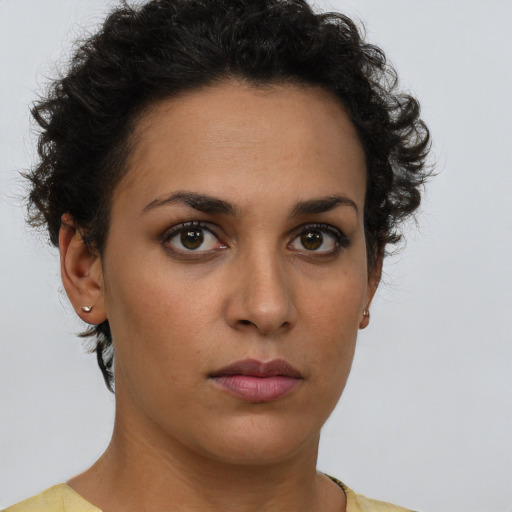 Neutral latino young-adult female with short  brown hair and brown eyes