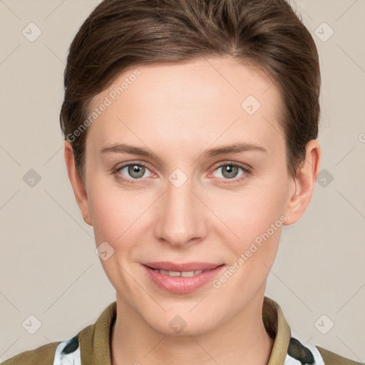 Joyful white young-adult female with short  brown hair and grey eyes