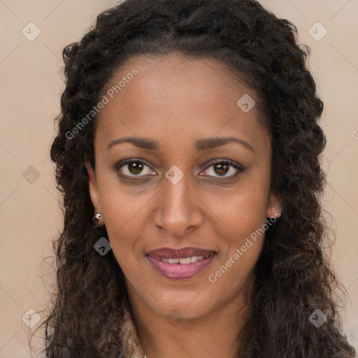 Joyful black young-adult female with long  brown hair and brown eyes