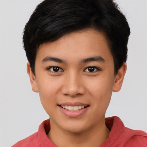 Joyful asian young-adult female with short  brown hair and brown eyes
