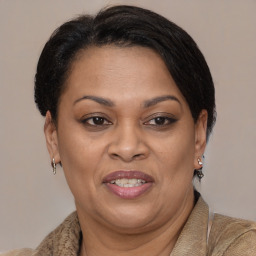 Joyful black adult female with medium  brown hair and brown eyes