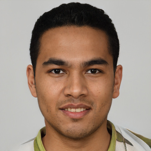 Joyful white young-adult male with short  black hair and brown eyes