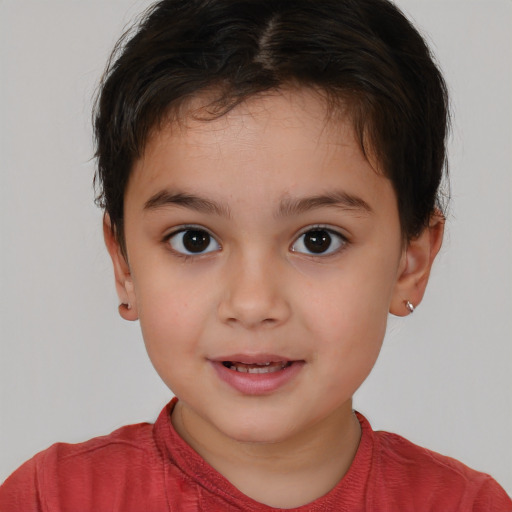 Joyful white child female with short  brown hair and brown eyes