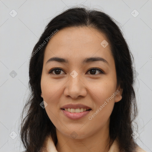 Joyful latino young-adult female with long  brown hair and brown eyes