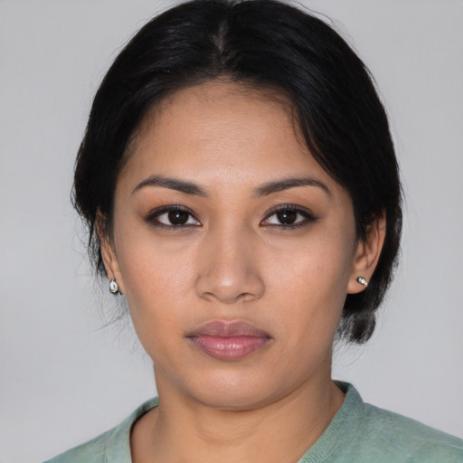 Neutral latino young-adult female with medium  black hair and brown eyes
