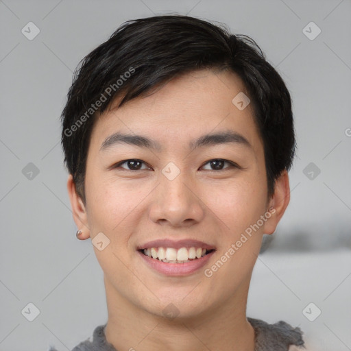 Joyful asian young-adult male with short  black hair and brown eyes