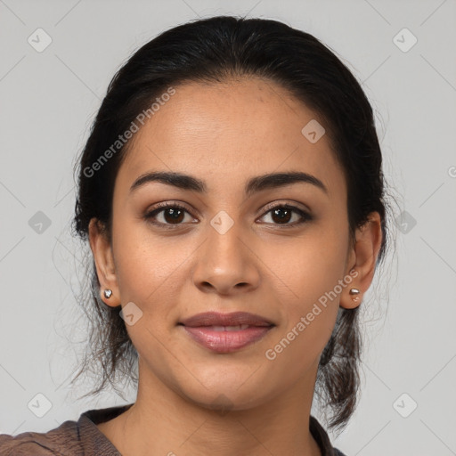 Joyful latino young-adult female with medium  brown hair and brown eyes