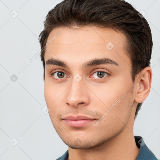 Neutral white young-adult male with short  brown hair and brown eyes