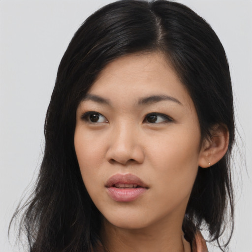 Joyful asian young-adult female with medium  black hair and brown eyes