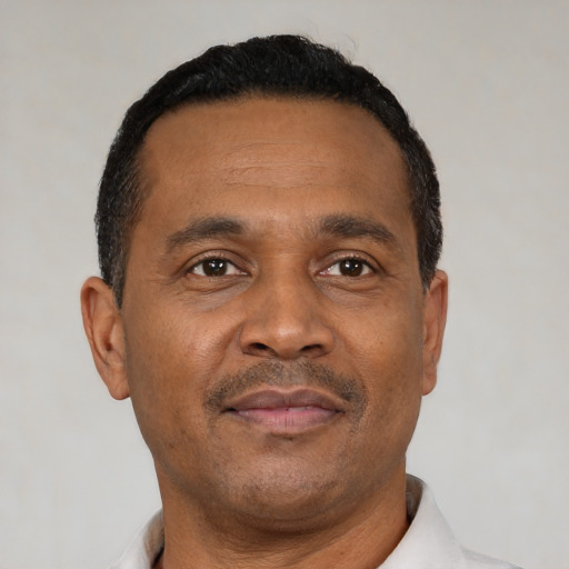Neutral latino adult male with short  black hair and brown eyes