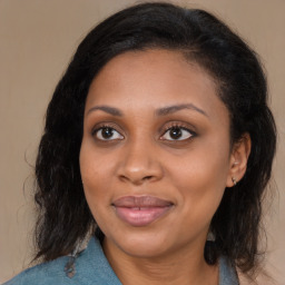 Joyful black young-adult female with medium  brown hair and brown eyes