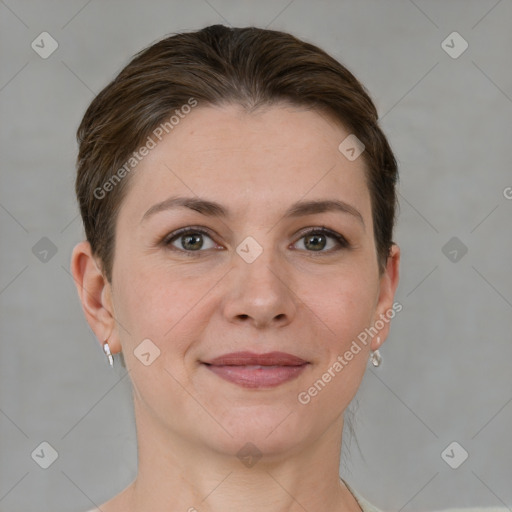 Joyful white young-adult female with short  brown hair and grey eyes