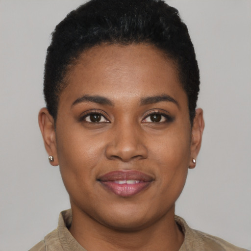 Joyful black young-adult female with short  brown hair and brown eyes