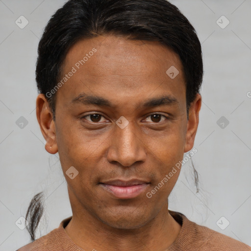 Joyful black young-adult male with short  black hair and brown eyes