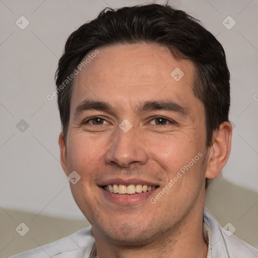 Joyful white adult male with short  brown hair and brown eyes