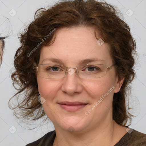 Joyful white adult female with medium  brown hair and blue eyes