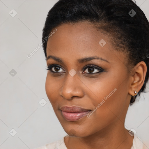 Joyful black young-adult female with short  brown hair and brown eyes