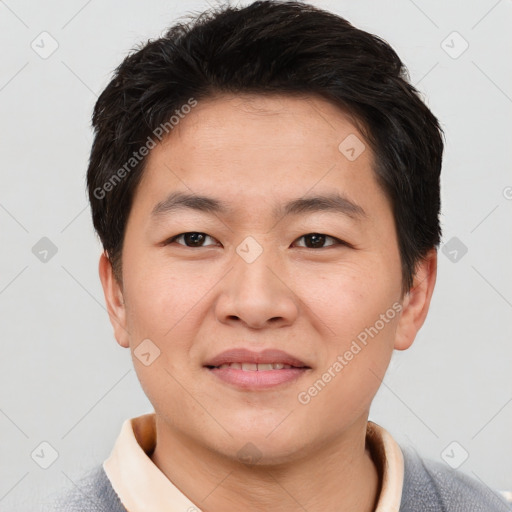 Joyful asian young-adult male with short  brown hair and brown eyes