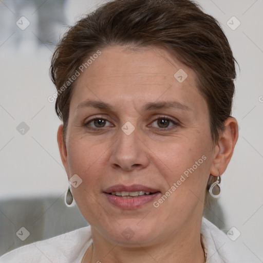 Joyful white adult female with short  brown hair and brown eyes