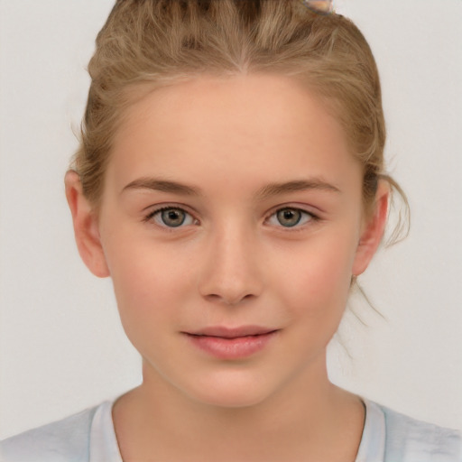 Joyful white child female with medium  brown hair and brown eyes