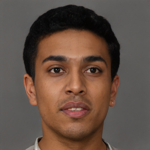 Neutral latino young-adult male with short  brown hair and brown eyes