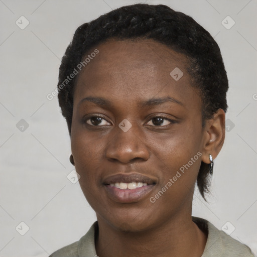 Joyful black young-adult female with short  black hair and brown eyes