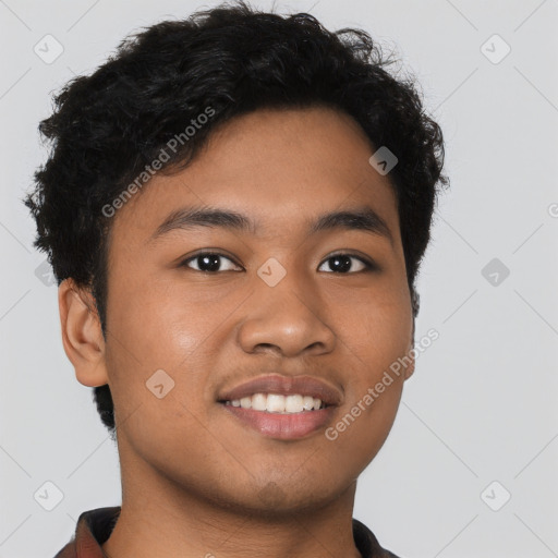 Joyful latino young-adult male with short  brown hair and brown eyes