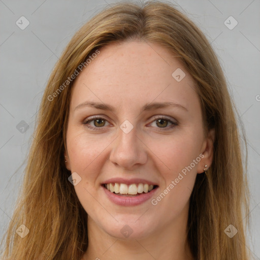 Joyful white young-adult female with long  brown hair and green eyes