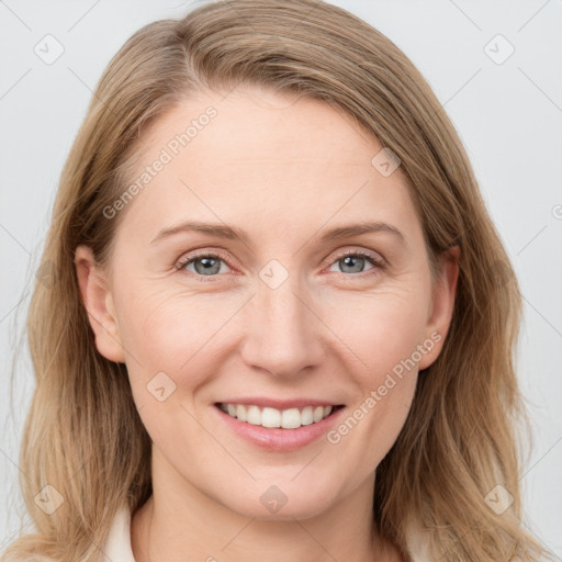 Joyful white young-adult female with medium  brown hair and blue eyes