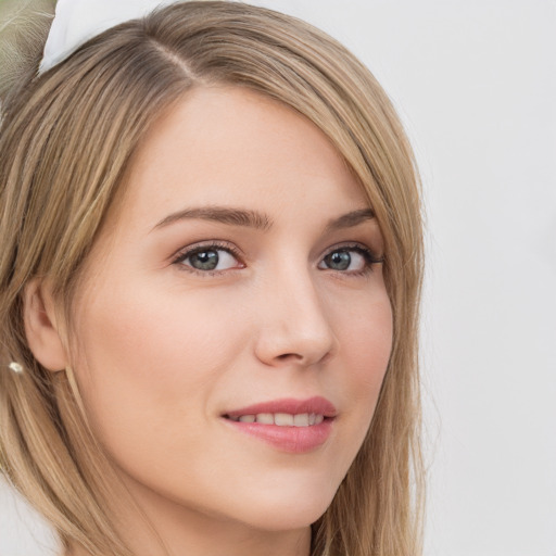 Joyful white young-adult female with long  brown hair and green eyes